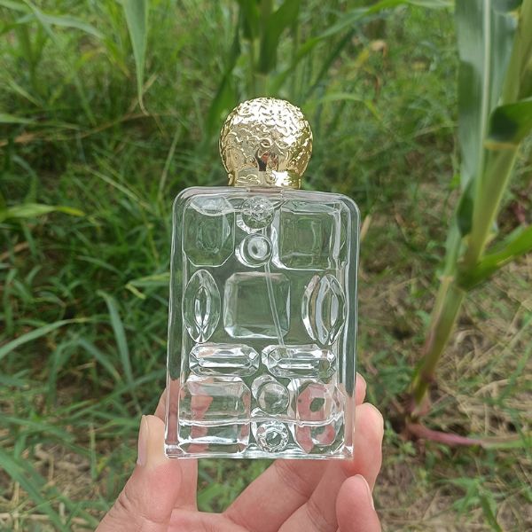 Customized 100ml flat square carved bayonet glass perfume bottles