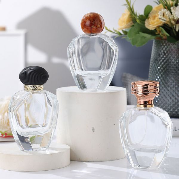 Wholesale 80ml perfume glass bottles resin bottle cap irregular clear perfume bottles